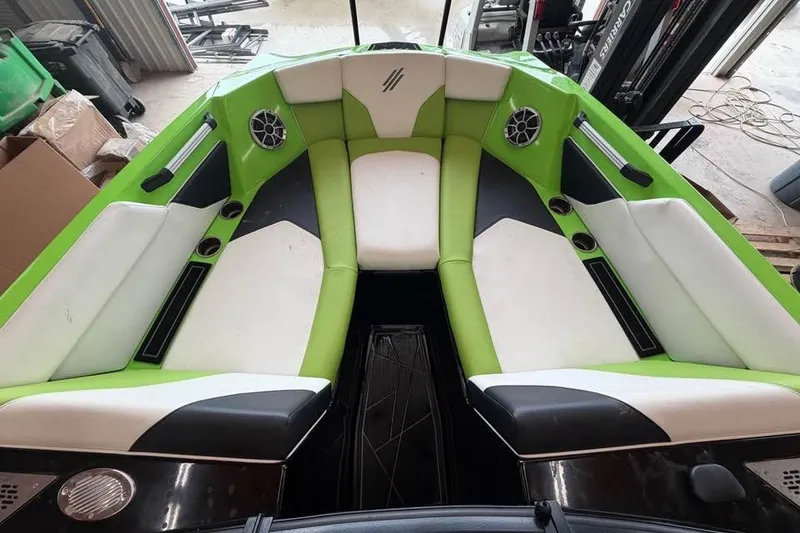 Slide: The Image of Interior of 2022 ATX Surf Boats 24 Type-S with green and white seating. - 12