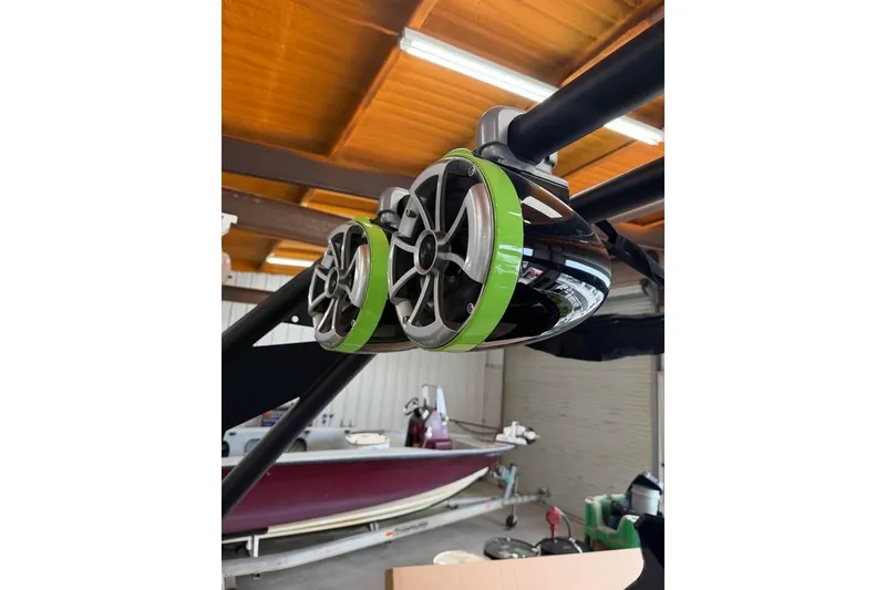 Slide: The Image of Speakers on 2022 ATX Surf Boats 24 Type-S, featuring sleek design and vibrant green accents. - 14