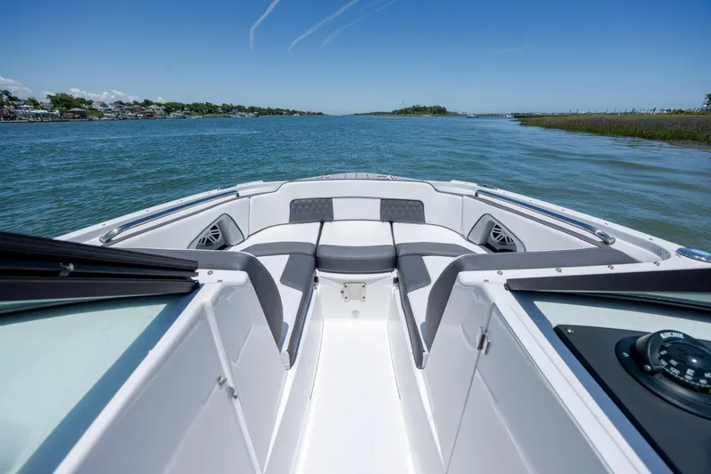 Slide: The Image of 2024 Monterey M-45 boat cruising on a serene waterway under a clear blue sky. - 11