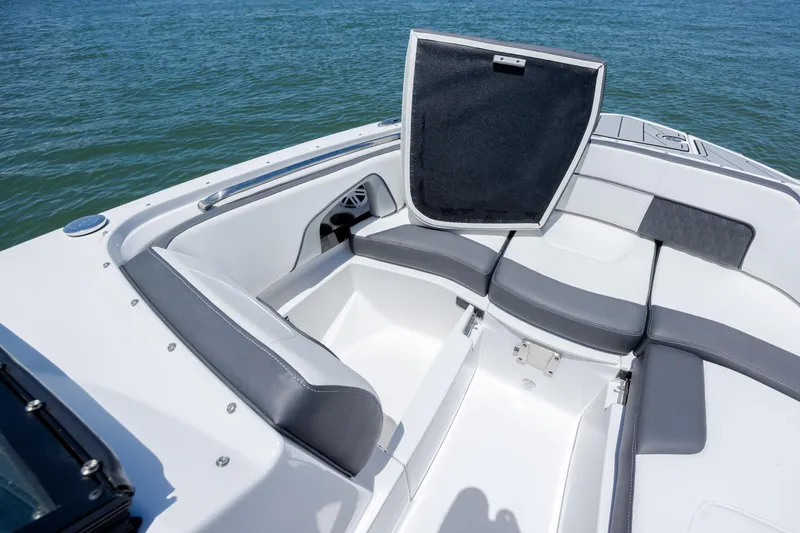 Slide: The Image of 2024 Monterey M-45 boat interior with open storage compartment and cushioned seating. - 13