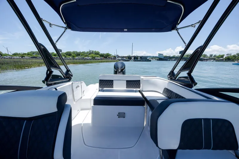 Slide: The Image of 2024 Monterey M-45 boat interior with luxurious seating and canopy on a sunny day. - 16