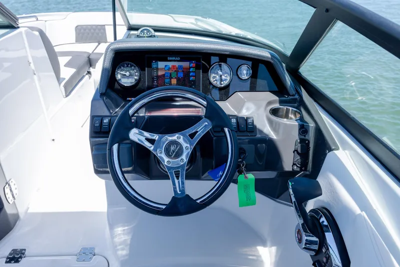 Slide: The Image of 2024 Monterey M-45 boat dashboard with steering wheel and digital display. - 19