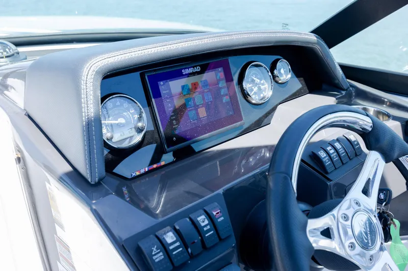 Slide: The Image of 2024 Monterey M-45 boat dashboard with digital display and steering wheel. - 20