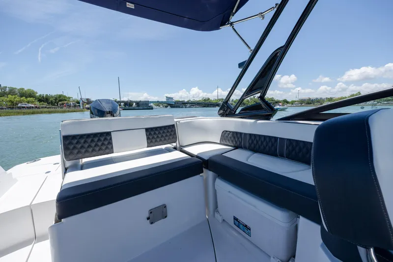 Slide: The Image of 2024 Monterey M-45 boat interior with luxurious seating on a sunny day. - 29