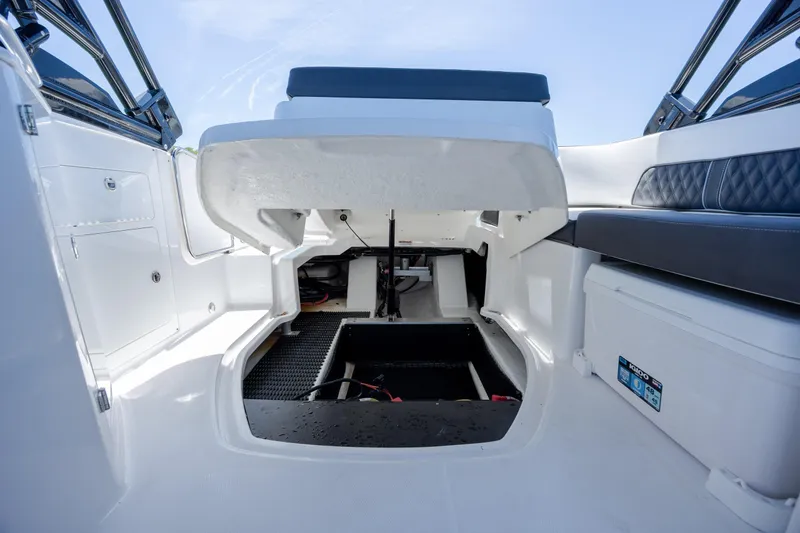 Slide: The Image of 2024 Monterey M-45 boat interior with open storage compartment and seating area. - 30