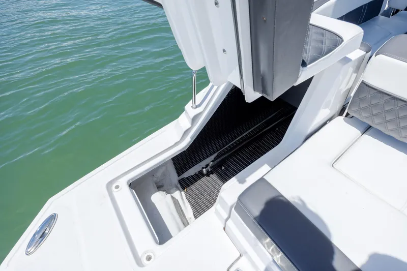 Slide: The Image of 2024 Monterey M-45 boat interior with white seating and water view. - 35