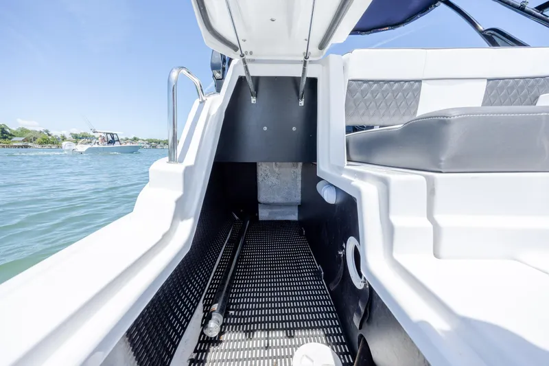 Slide: The Image of 2024 Monterey M-45 boat interior with seating and open water view. - 36