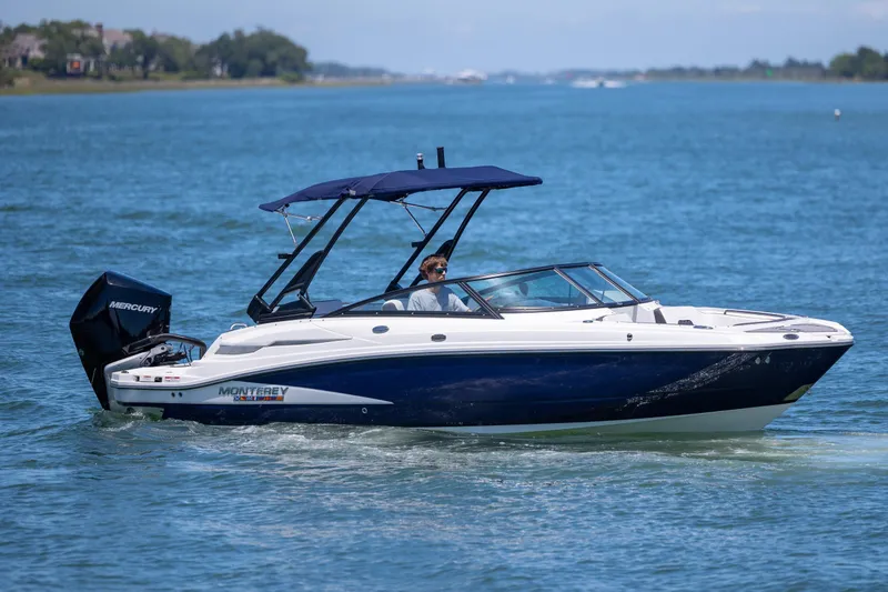 Slide: The Image of 2024 Monterey M-45 boat cruising on a sunny day with a Mercury engine. - 8