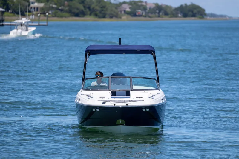 Slide: The Image of 2024 Monterey M-45 boat cruising on a serene blue lake under clear skies. - 9