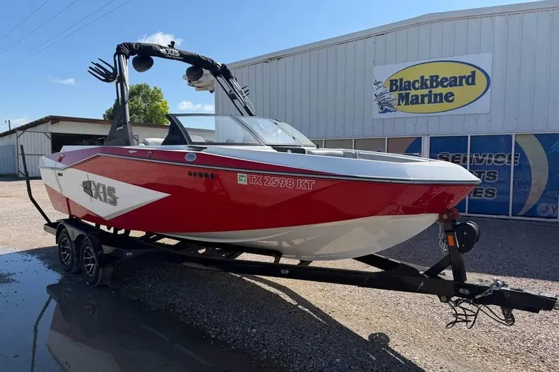 The Image of Red 2022 Axis T220 boat on trailer at BlackBeard Marine dealership. - 0