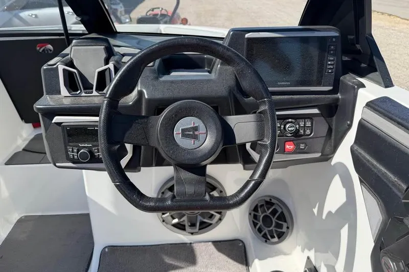 Slide: The Image of 2022 Axis T220 boat dashboard with steering wheel and control panel. - 8