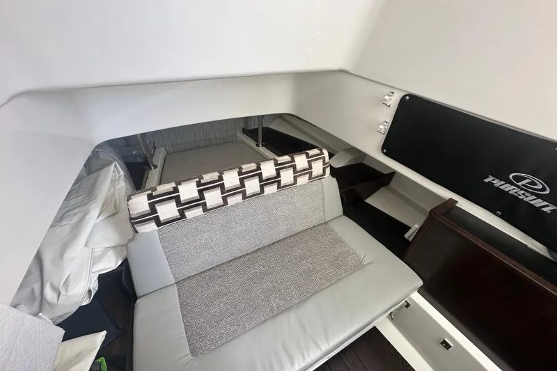 Slide: The Image of Interior of 2021 Pursuit S 328 Sport boat with seating and storage area. - 28