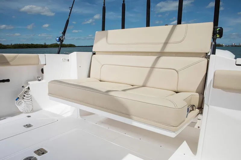 Slide: The Image of Manufacturer Provided Image: 2021 Pursuit S 328 Sport boat with beige seating and fishing rod holders. - 43