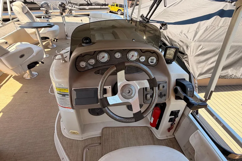 Slide: The Image of Steering console of a 2006 Premier 250 Grand Majestic RE pontoon boat. - 7