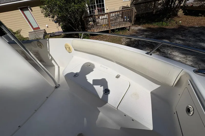 Slide: The Image of 2005 Century 2200 Center Console boat interior with seating and storage compartments. - 11