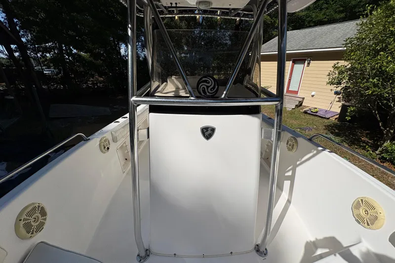 Slide: The Image of 2005 Century 2200 Center Console boat with stainless steel railings and speakers. - 13