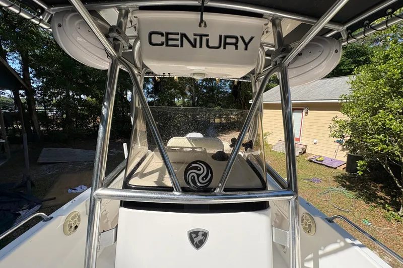 Slide: The Image of 2005 Century 2200 Center Console boat with T-top and outdoor setting. - 14