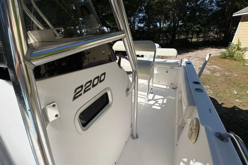 Slide: The Image of 2005 Century 2200 Center Console boat interior with seating and console details. - 15