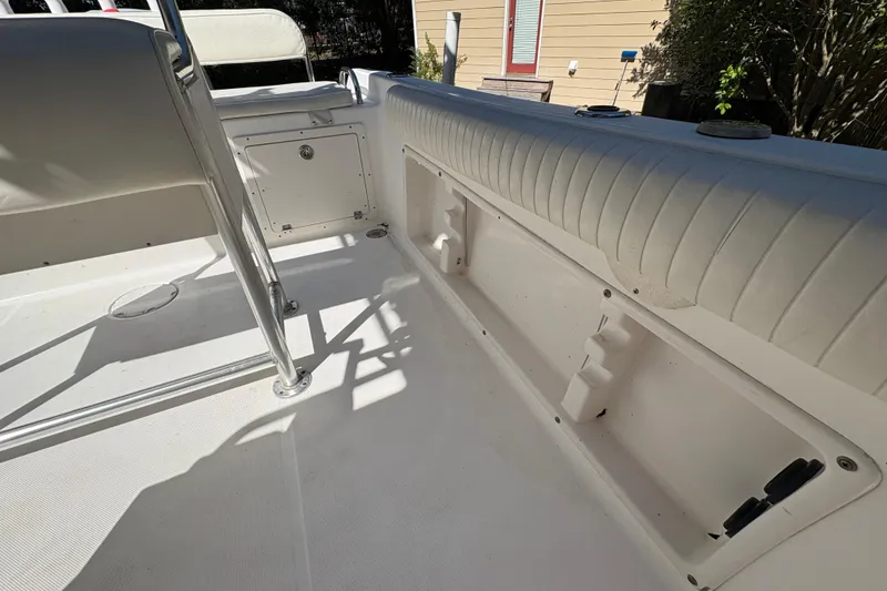 Slide: The Image of 2005 Century 2200 Center Console boat interior with seating and storage compartments. - 17