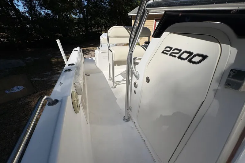 Slide: The Image of 2005 Century 2200 Center Console boat interior with seating and storage compartments. - 18