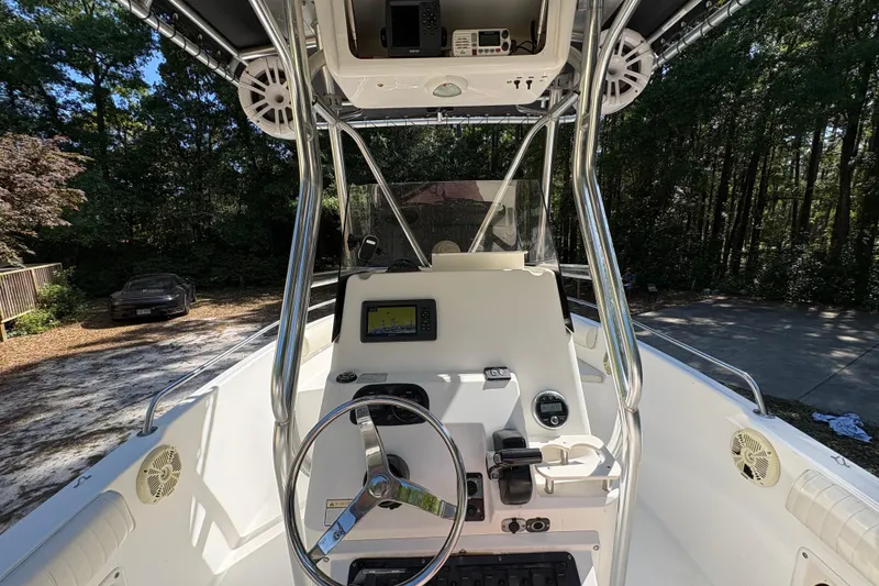 Slide: The Image of 2005 Century 2200 Center Console boat interior with steering wheel and navigation equipment. - 23