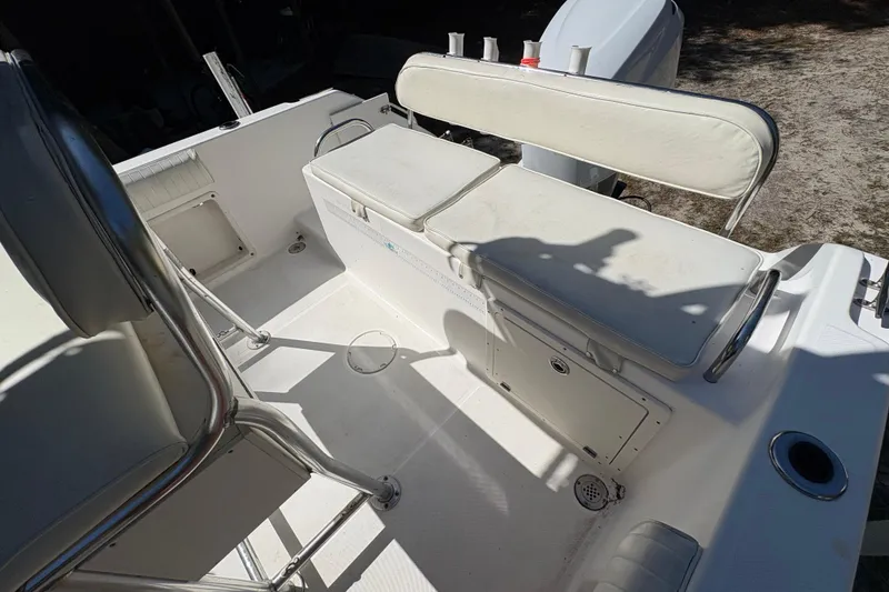 Slide: The Image of 2005 Century 2200 Center Console boat interior with seating and storage compartments. - 28