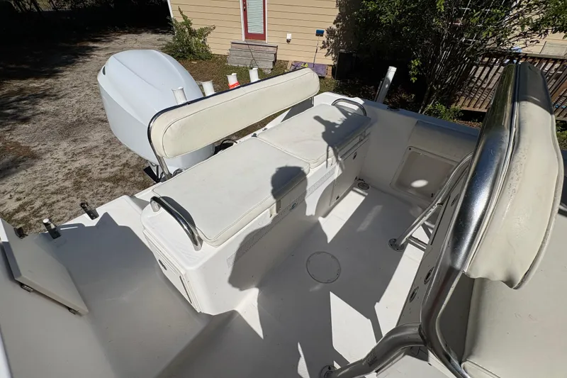 Slide: The Image of 2005 Century 2200 Center Console boat interior with seating and storage compartments. - 29