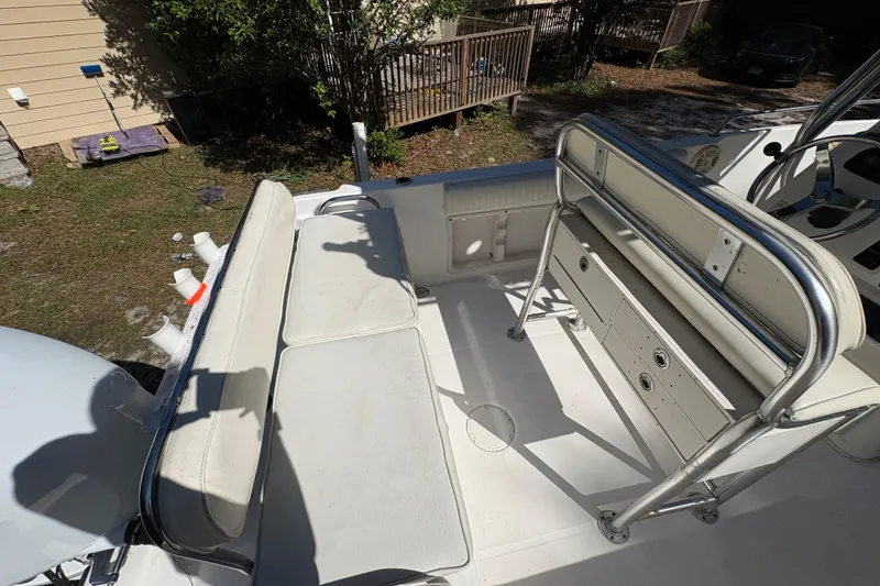 Slide: The Image of 2005 Century 2200 Center Console boat interior with seating and storage compartments. - 30