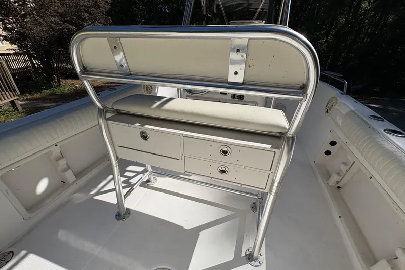Slide: The Image of 2005 Century 2200 Center Console boat interior with seating and storage drawers. - 31