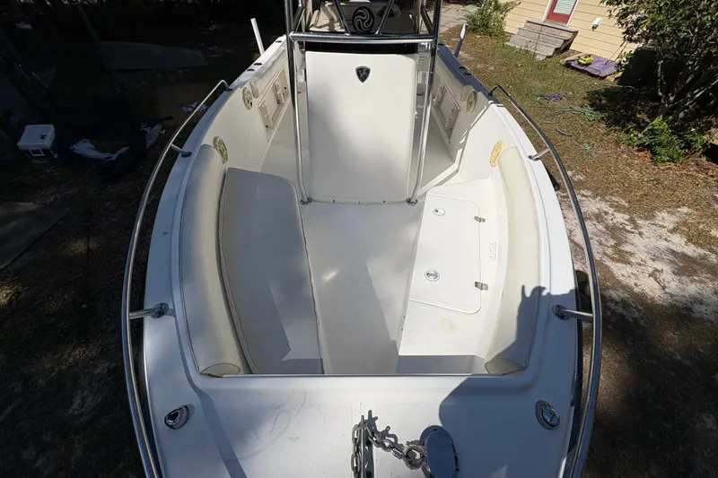 Slide: The Image of 2005 Century 2200 Center Console boat interior with seating and storage compartments. - 9