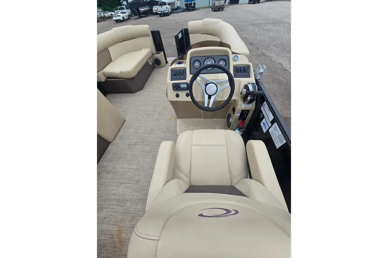 Slide: The Image of Interior view of 2019 Crest I L Cp2 boat with beige seating and steering console. - 15