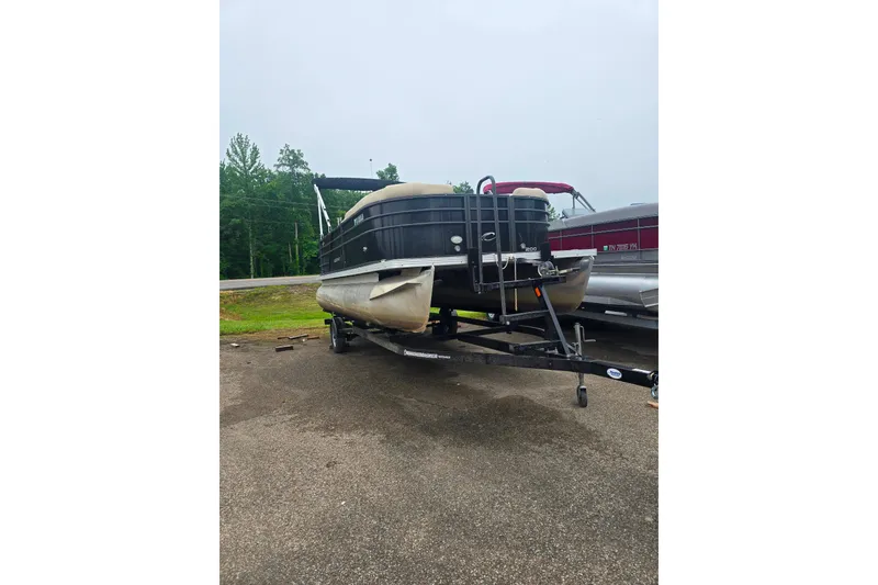 Slide: The Image of 2019 Crest I L Cp2 pontoon boat on trailer, parked outdoors. - 3