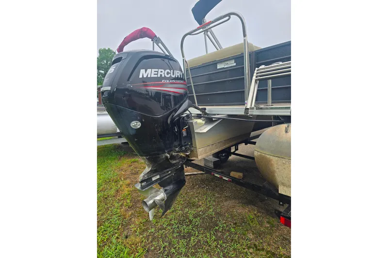 Slide: The Image of 2019 Crest I L Cp2 pontoon boat with Mercury outboard motor on trailer. - 4