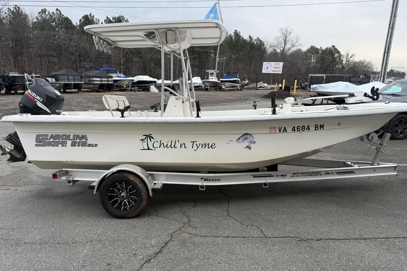 The Image of 2008 Carolina Skiff 218 DLV boat on trailer, featuring "Chill'n Tyme" decal. - 0