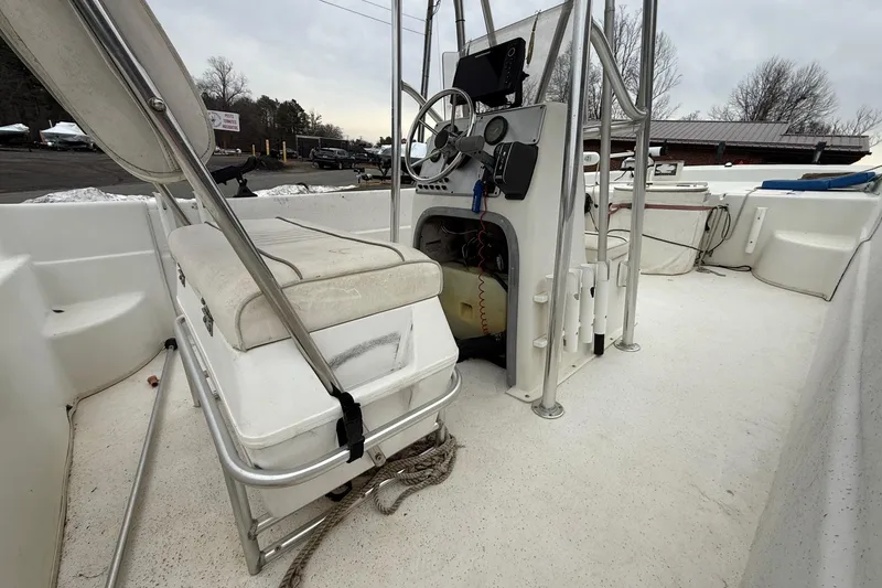 Slide: The Image of 2008 Carolina Skiff 218 DLV boat interior with steering console and seating. - 11