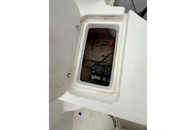 Slide: The Image of Battery compartment of a 2008 Carolina Skiff 218 DLV boat, showing wiring and connections. - 17