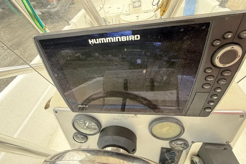 Slide: The Image of Helix 9 Humminbird fishfinder on 2008 Carolina Skiff 218 DLV dashboard. - 19