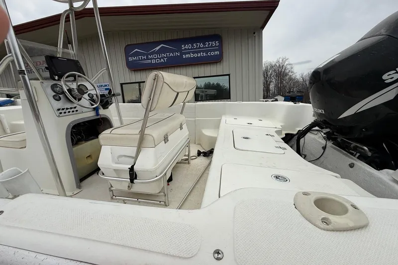 Slide: The Image of 2008 Carolina Skiff 218 DLV boat interior with Suzuki engine at Smith Mountain Boat. - 6