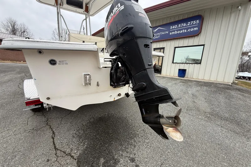 Slide: The Image of 2008 Carolina Skiff 218 DLV with Suzuki outboard motor at dealership. - 8