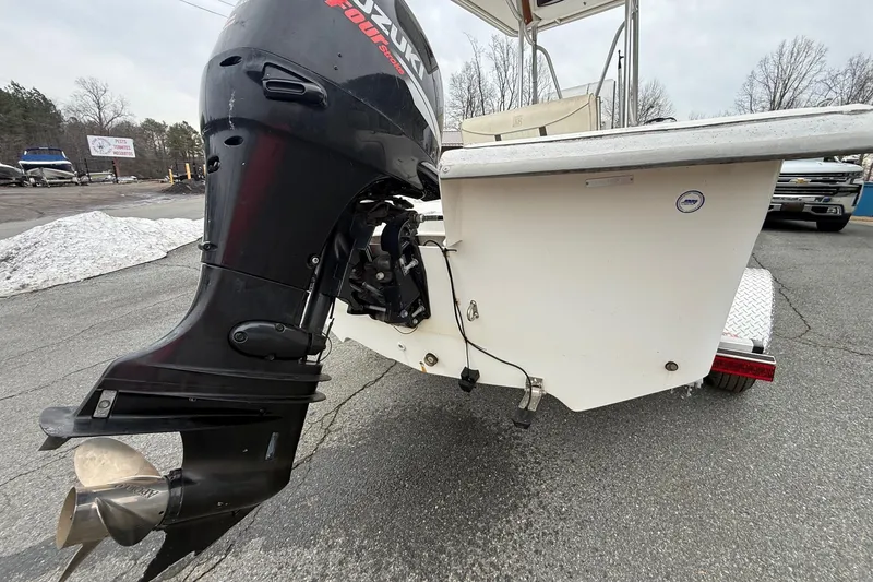 Slide: The Image of 2008 Carolina Skiff 218 DLV with Suzuki outboard motor on trailer. - 9