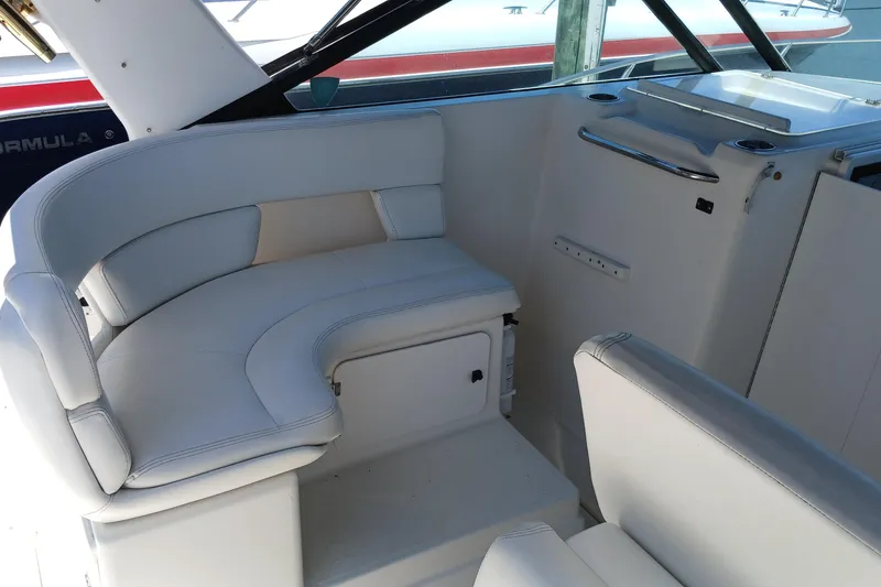 Slide: The Image of 2001 Tiara Yachts 2900 Open boat seat, white upholstery, folded position. - 12