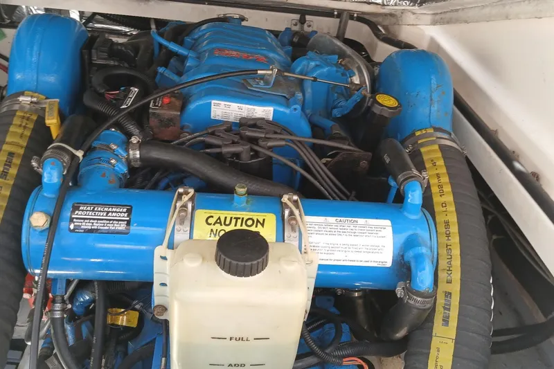Slide: The Image of Engine compartment of a 2001 Tiara Yachts 2900 Open, featuring dual blue engines. - 28