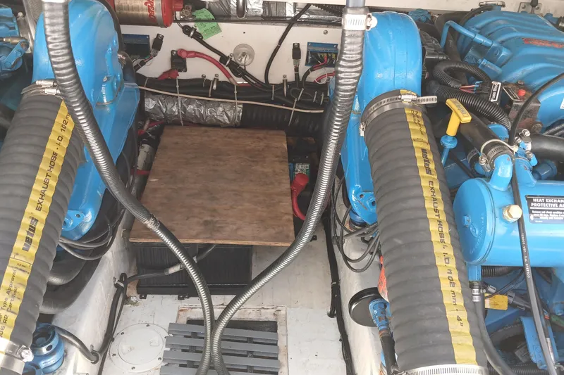 Slide: The Image of Storage compartments on a 2001 Tiara Yachts 2900 Open, containing black boat fenders. - 29