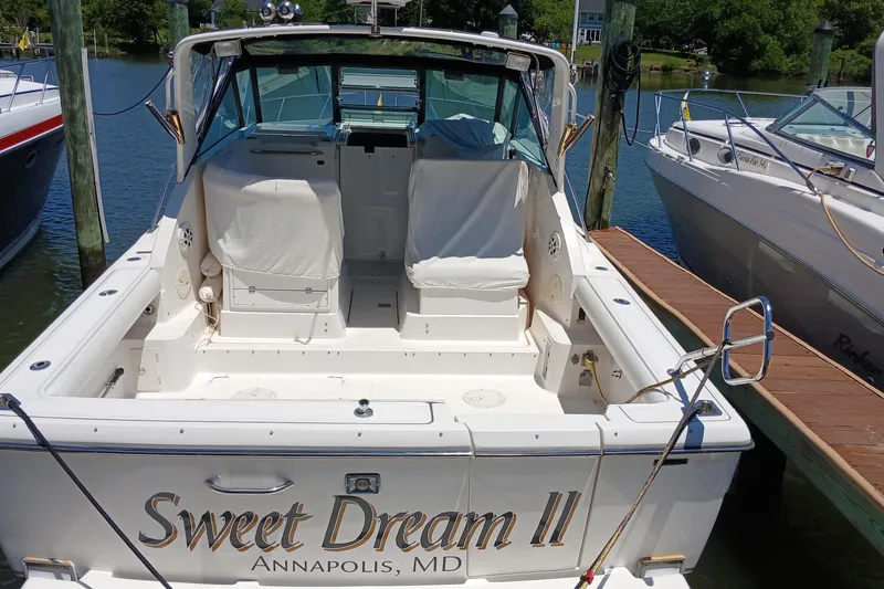 Slide: The Image of 2001 Tiara Yachts 2900 Open docked, featuring "Sweet Dream II" name on the stern. - 7