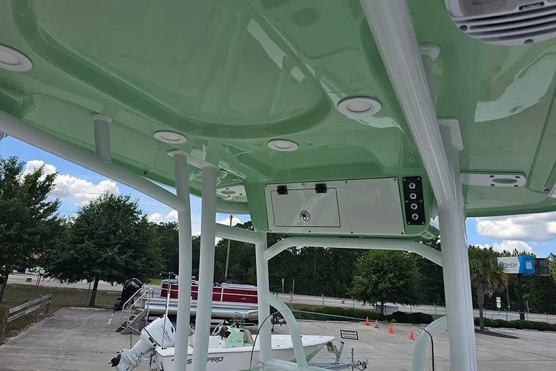 Slide: The Image of 2026 Sea Pro 202 Center Console boat interior with green canopy and modern features. - 12