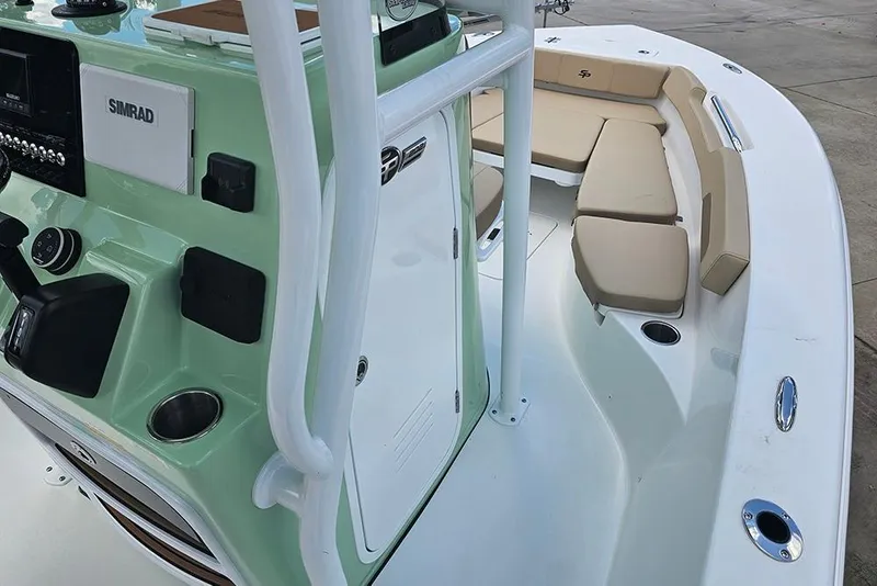 Slide: The Image of 2026 Sea Pro 202 Center Console boat interior with seating and control panel. - 14
