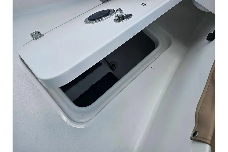 Slide: The Image of Open storage compartment on a 2026 Sea Pro 202 Center Console boat. - 17
