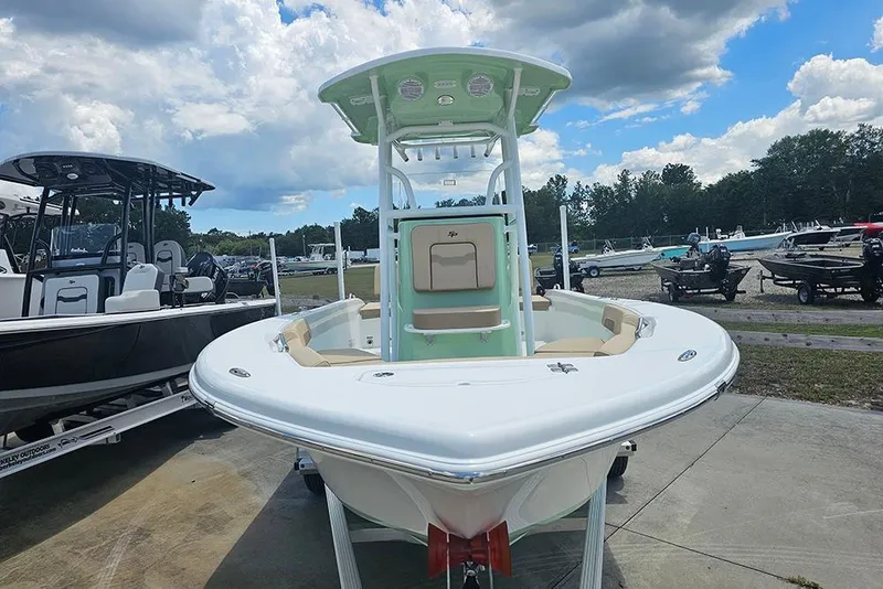 Slide: The Image of 2026 Sea Pro 202 Center Console boat displayed outdoors under a cloudy sky. - 4