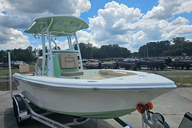 Slide: The Image of 2026 Sea Pro 202 Center Console boat on trailer under cloudy sky. - 5