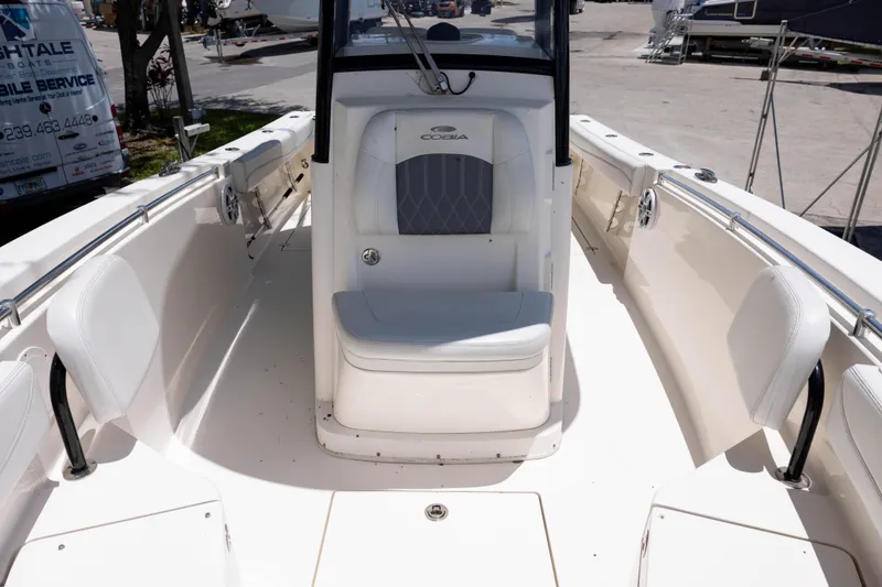 Slide: The Image of 2020 Cobia 262 Center Console boat interior with white seating and console. - 10